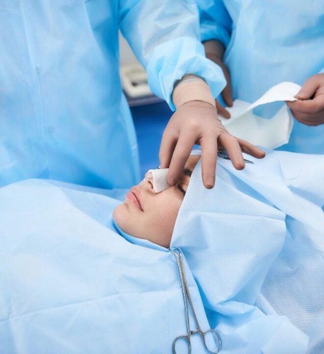 Two plastic surgeons preparing special bandages for female nose after surgery